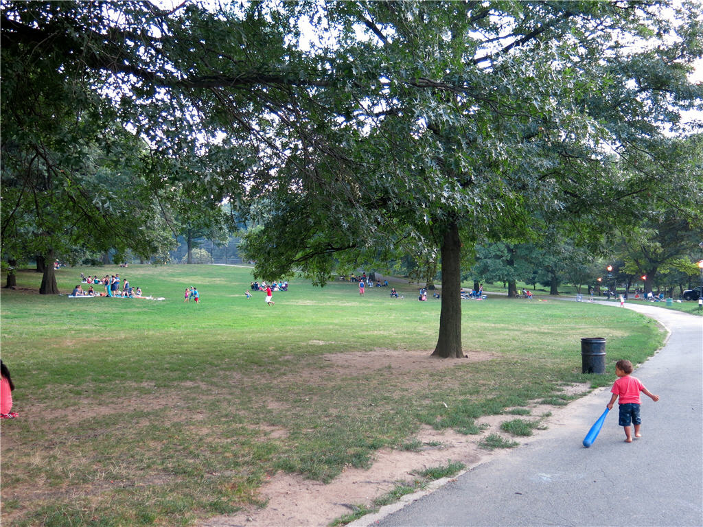 Families picnicking and children playing at Inwood Park