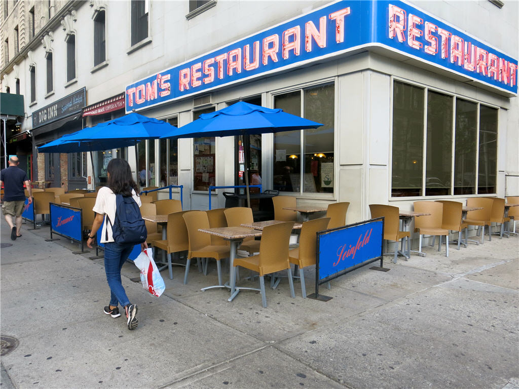 Tables and chairs adorn Tom's Restaurant on the corner of Broadway & W 112 St.